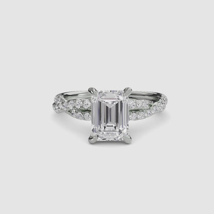 The Twisted Pavé Solitaire Emerald cut in White Gold